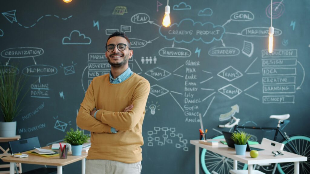 Confident founder of Search Engine Boosters standing in a modern office
