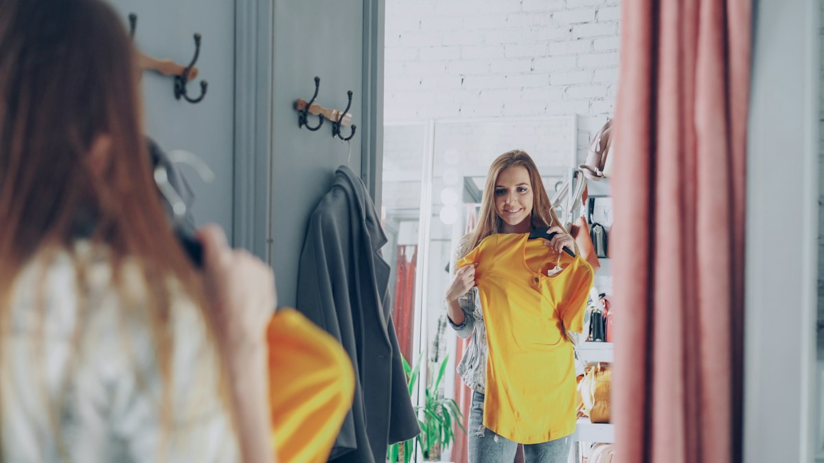 Customer trying on clothes in a fitting room