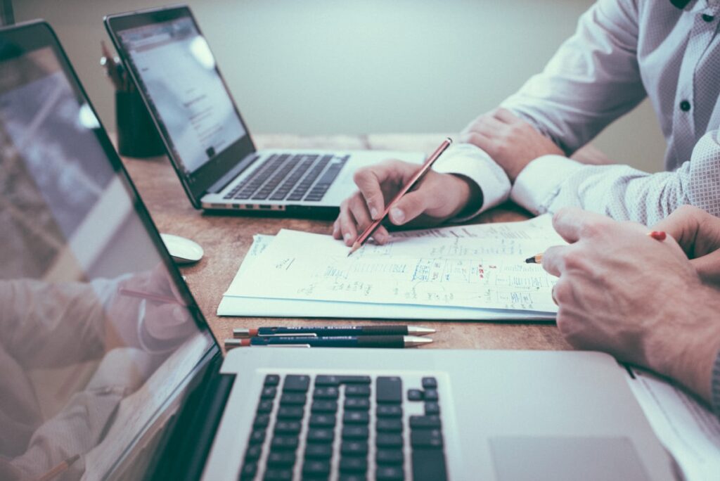 Marketing team comparing strategy options for lead generation