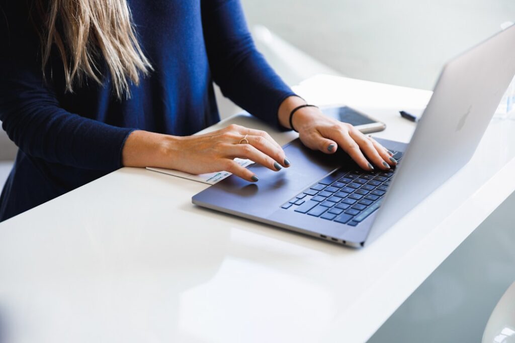 Business owner filling out an online business profile on a laptop