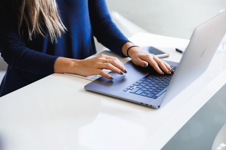 Business owner filling out an online business profile on a laptop